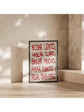 Dark framed Spanish motto print standing in a sunlit beige architectural interior