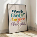 Colorful work hard and be kind quote print in a sunlit room