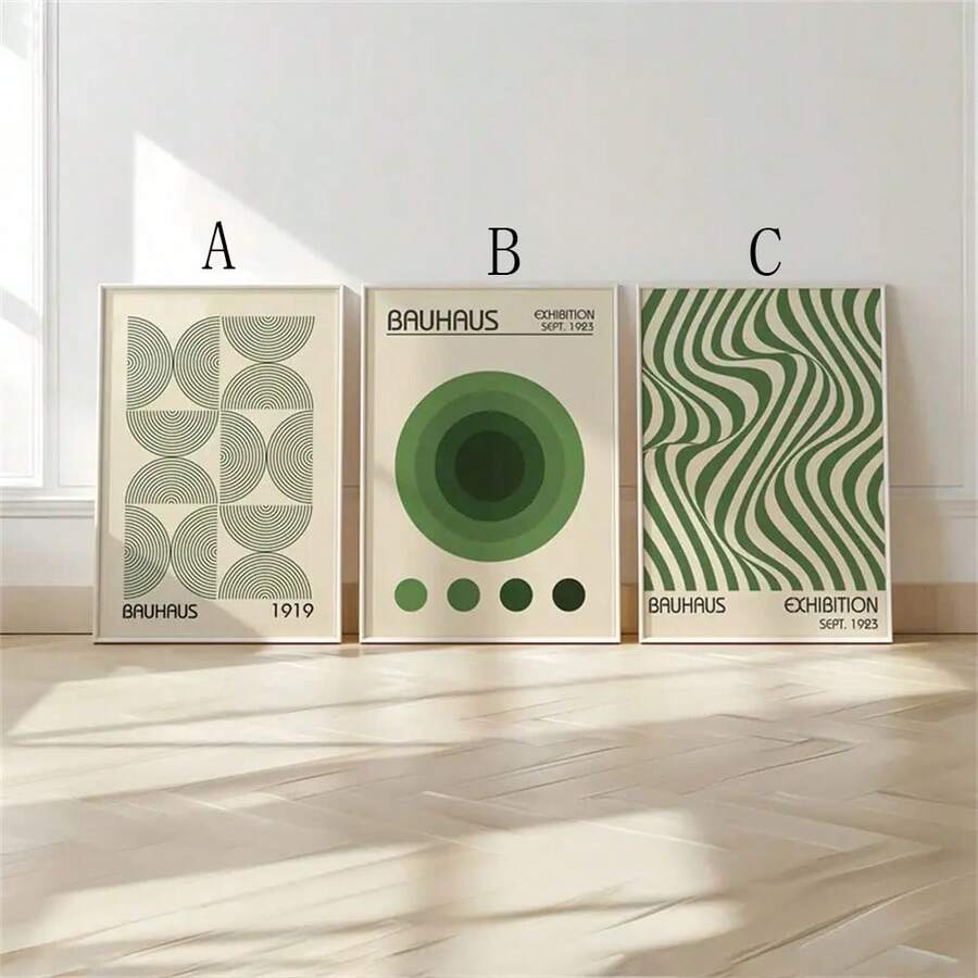 Bauhaus geometric prints A B and C arranged on a sunlit floor