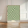 Green and cream wavy stripe Bauhaus poster in a black frame