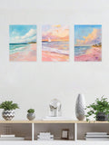 Three frameless beach wall art prints above console shelf with plants books vase and butterfly decor