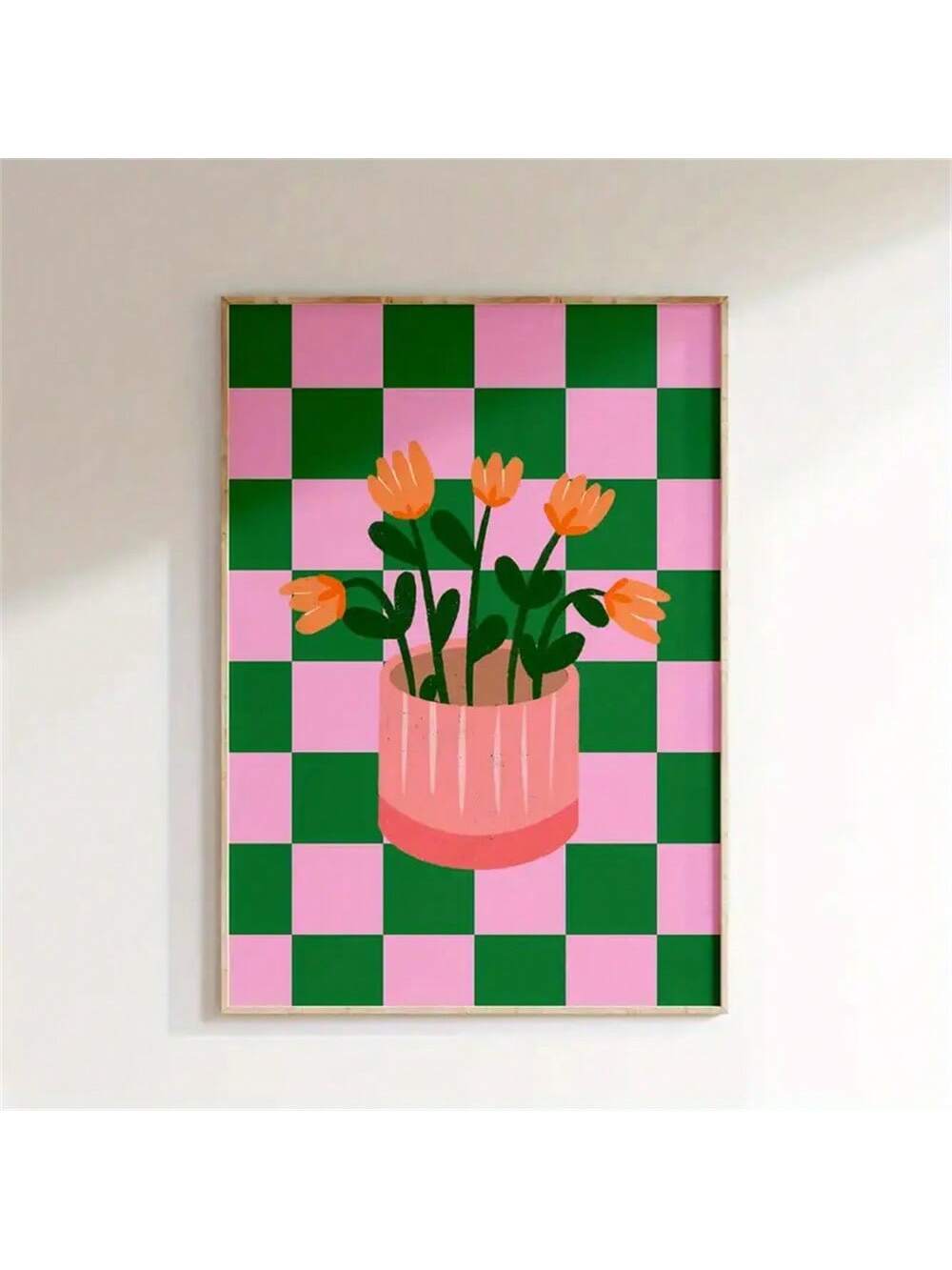 Elevate your interior with this contemporary floral wall art print, featuring a striking composition of vibrant orange blooms set against a soft pink and green checkered backdrop.