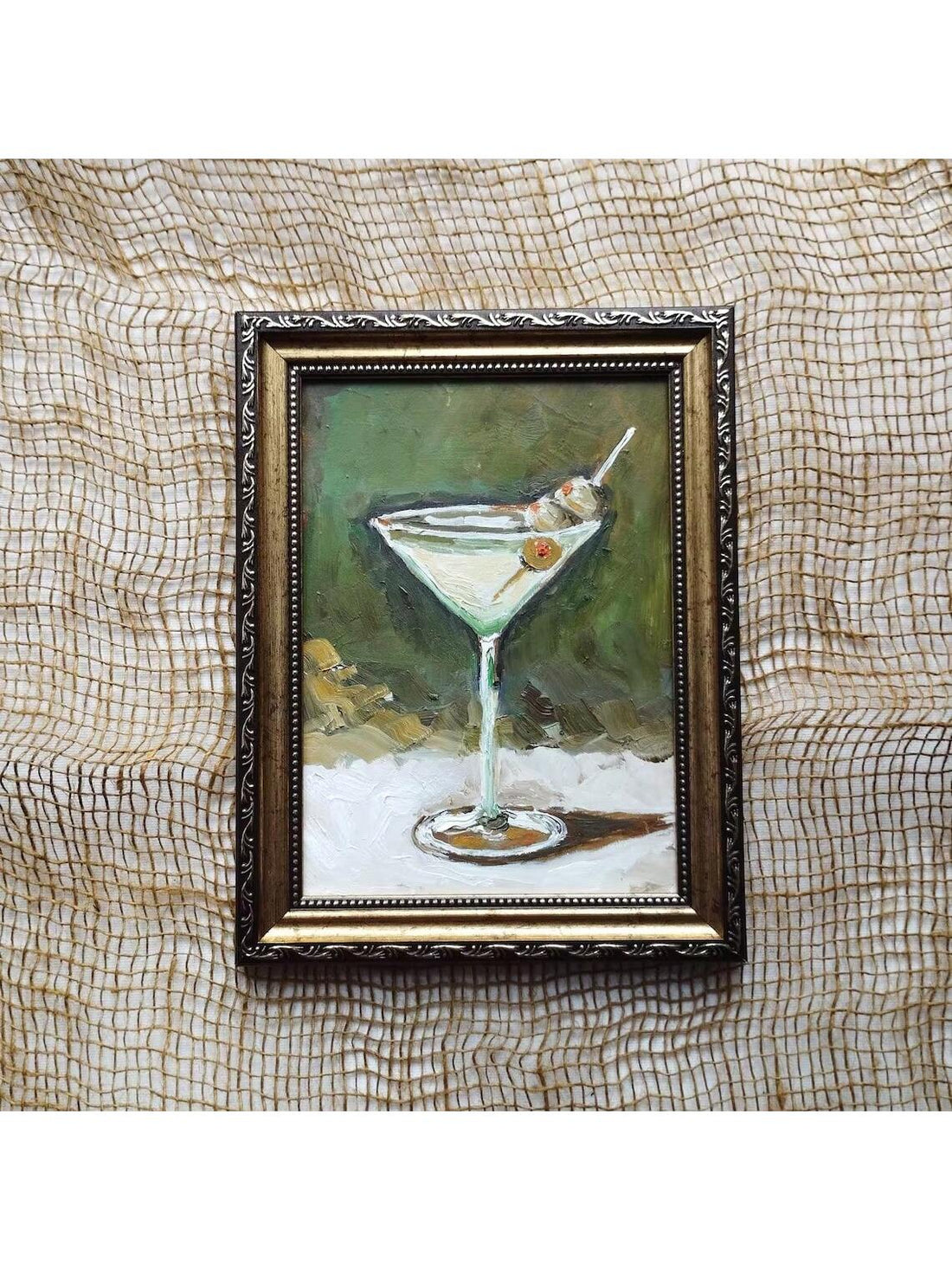 Elevate your entertaining space with this Vintage Dirty Martini Wall Art, a meticulously hand-painted oil painting that captures timeless bar cart charm. Perfectly suited for living room decor, this piece adds a sophisticated touch with its classic design, enhancing ambiance while reflecting your refined taste. Crafted with expert artistry, it brings warmth and personality to any setting, making it an ideal focal point for cocktail lovers and art enthusiasts alike.