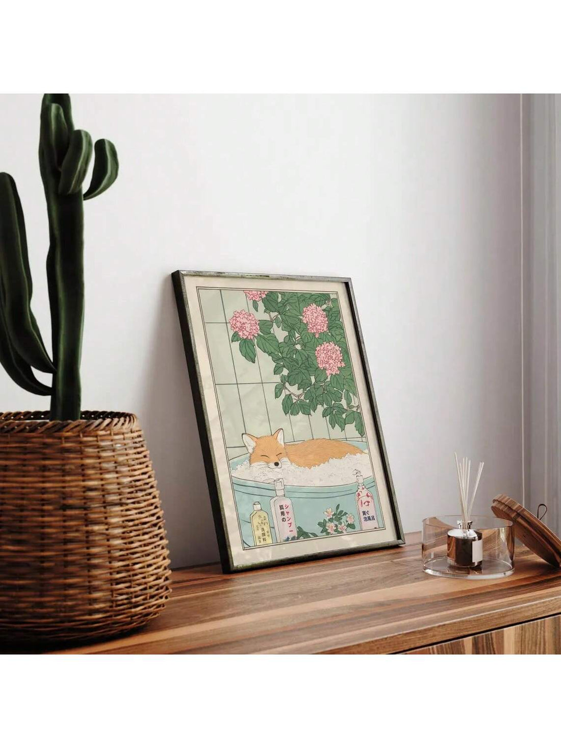 This vintage Japanese-inspired wall art features a serene fox reclining in a bathtub, rendered in a minimalist style with neutral tones. Perfect for enhancing living rooms or bathrooms, it brings a subtle touch of traditional Japanese aesthetics combined with modern simplicity. Its calming design complements various interior styles, creating a peaceful and refined atmosphere in your space.