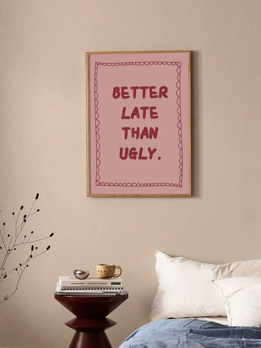 Pink framed quote print above bedside table in neutral bedroom