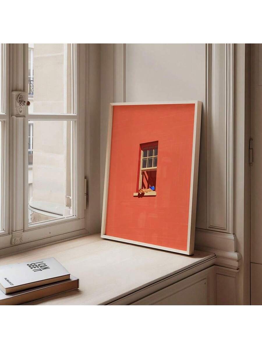 Pink wall art with reader window scene and orange cat on sill
