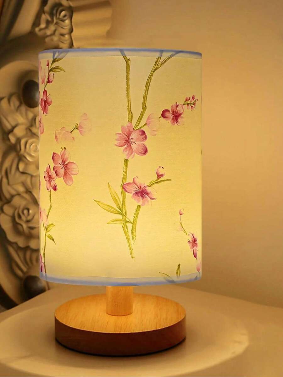 Floral fabric LED bedside lamp glowing warm yellow