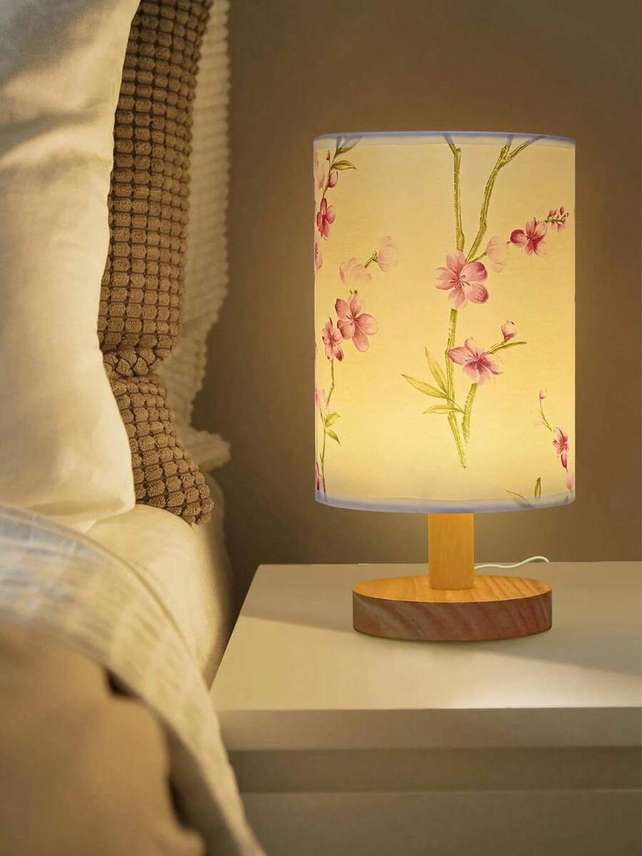 Floral fabric LED bedside lamp glowing warm yellow