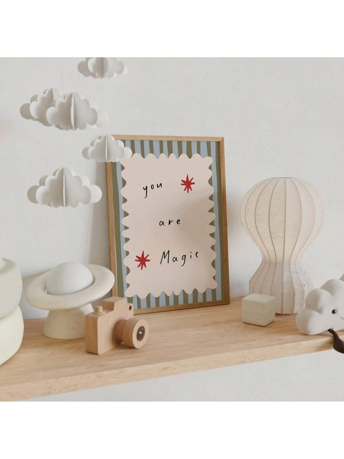 Create a captivating and enchanting atmosphere in your baby's nursery with the "You Are Magic" wall art. This whimsical heart print combines delicate design with a heartfelt message, inspiring wonder and positivity. Perfectly sized for any nursery, it adds a touch of magic and warmth to your baby's space, fostering a nurturing environment that celebrates imagination and love. Crafted with care, this art piece is an ideal choice for parents seeking meaningful and charming decor.