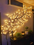 Bendable twig LED lamp with many small warm light tips.