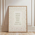 Vertical botanical love quote print styled against cream wall panels and wood floor