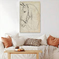 Minimal horse portrait above a sofa with rust pillows and a textured throw