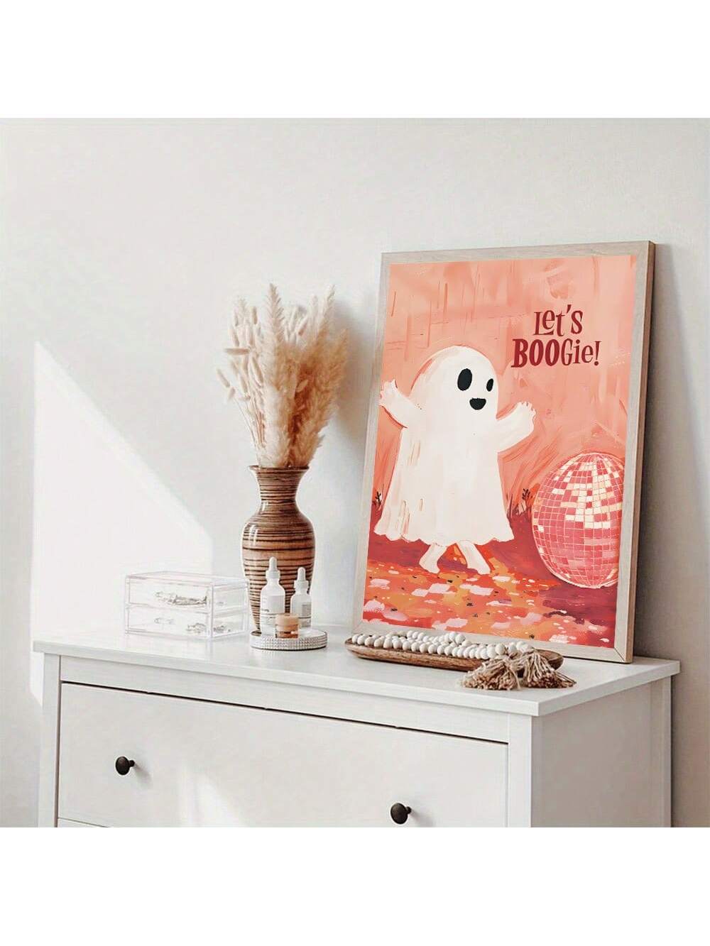 Elevate your Halloween décor with this Creative Abstract Pink Disco Ball Ghost Wall Art. Combining modern design with a playful twist, this unique piece adds a vibrant pop of pink and a disco-inspired shimmer to any room. Perfect for those seeking a contemporary yet festive atmosphere, it blends abstract art with seasonal charm to create a standout decoration that complements diverse interior styles.
