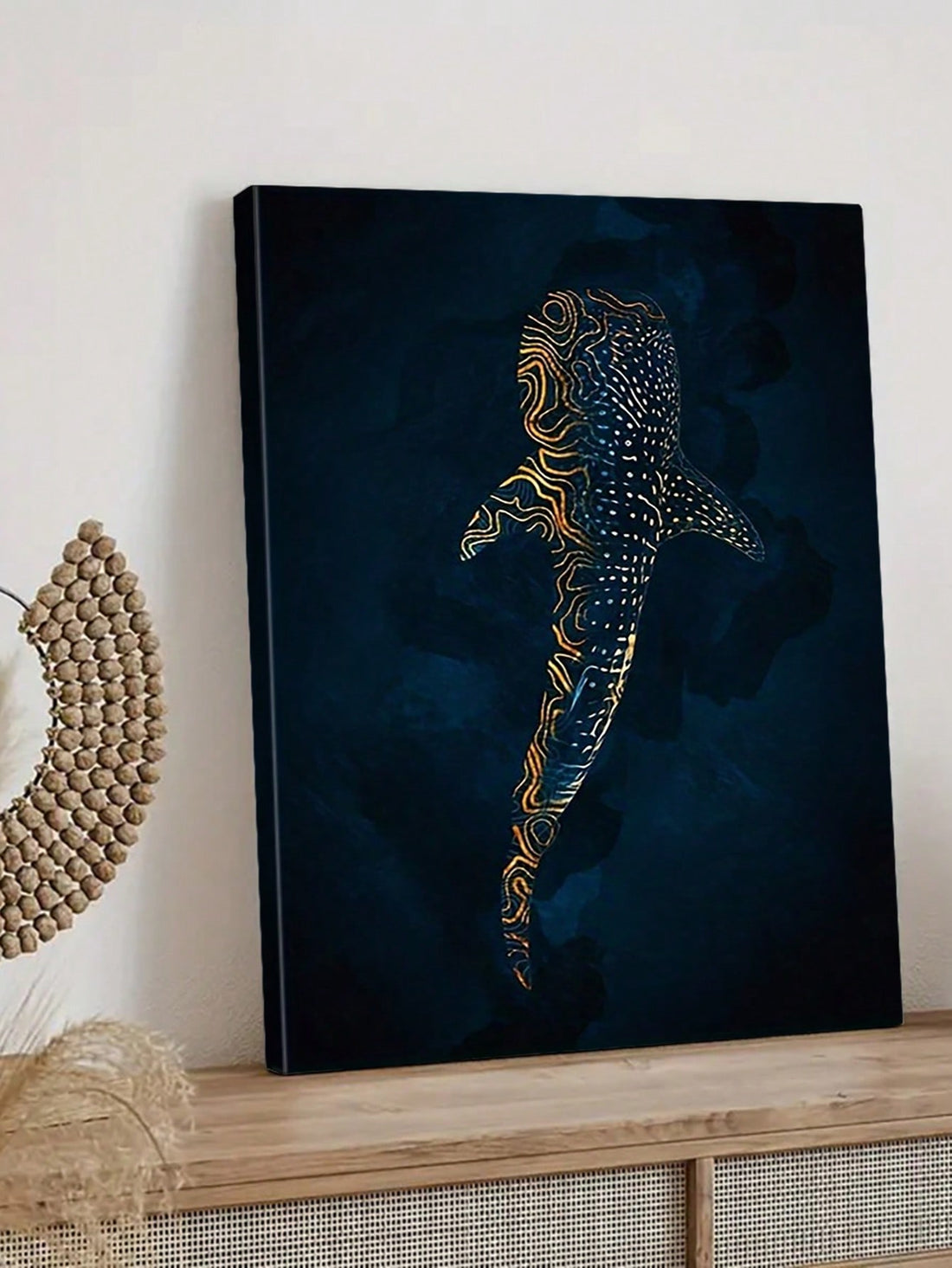 Elevate your living space with this elegant canvas art featuring a gold whale shark rendered in stylish blue and gold abstract tones. Designed for modern decor, this piece combines artistic sophistication with marine inspiration, creating a captivating focal point that adds depth and luxury to any room. Durable and visually striking, it complements contemporary interiors with a refined touch.