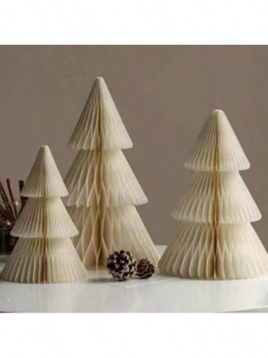 Transform your holiday spaces with this stunning 3D Beehive Paper Christmas Tree Decoration Set. Crafted from premium paper, these dimensional trees feature an intricate honeycomb design that catches light beautifully, creating visual depth and sophistication. Perfect for home mantels, office desks, retail displays, or party tables, this versatile set adapts to any décor style. The lightweight construction makes setup effortless, while the elegant beehive pattern adds a contemporary twist to traditional Chr