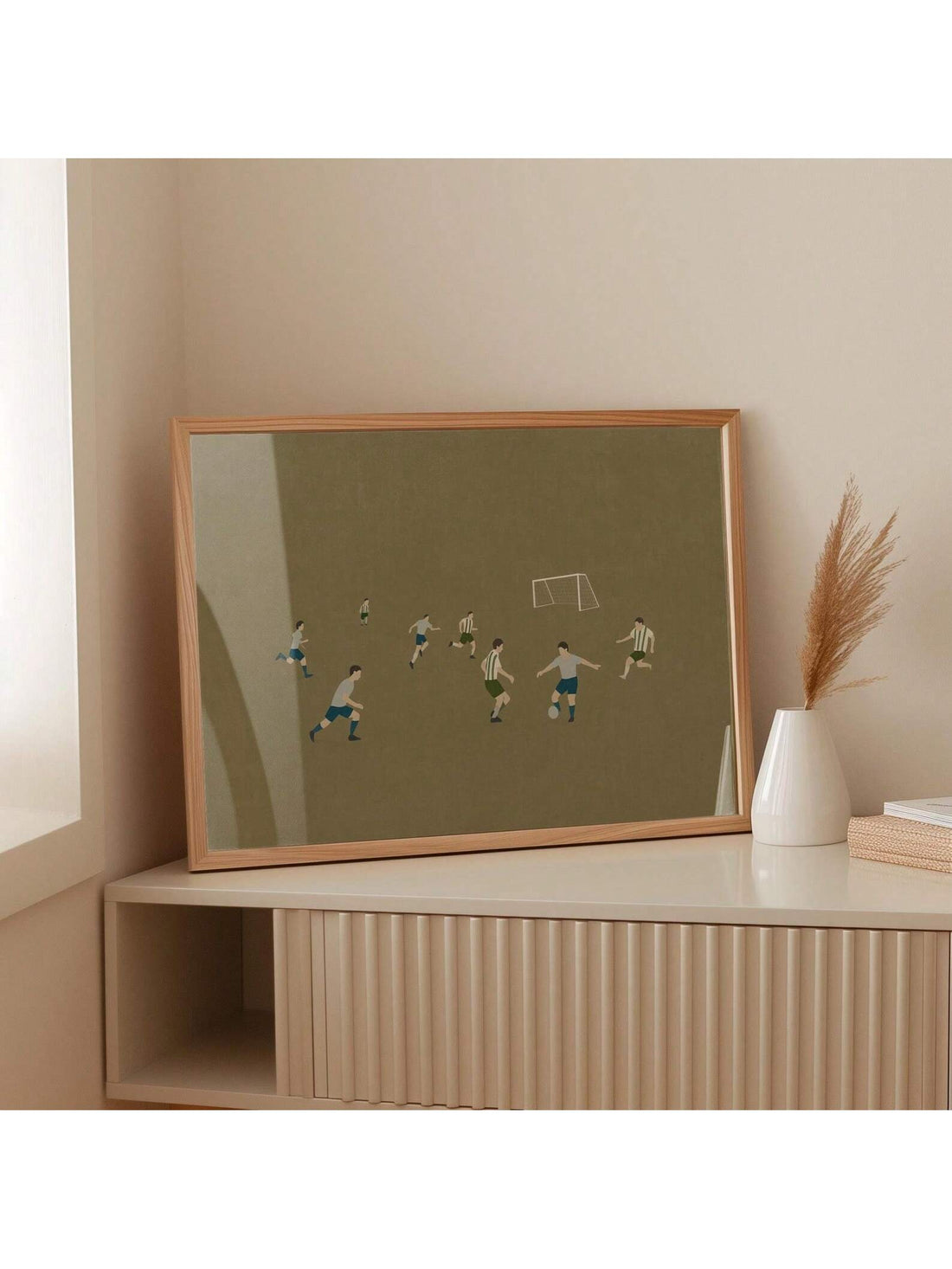 Elevate your space with this Retro Soccer Wall Art Print, designed with minimalist style to complement boys' rooms, game rooms, and man caves. Its clean lines and vintage-inspired design celebrate the spirit of football, adding a timeless touch to your decor. Perfect for enthusiasts seeking subtle yet impactful sports-themed artwork.