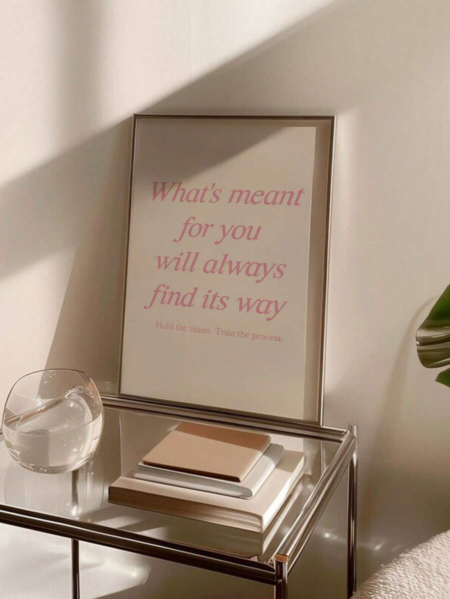 Office motivation art displayed in simple neutral room setting