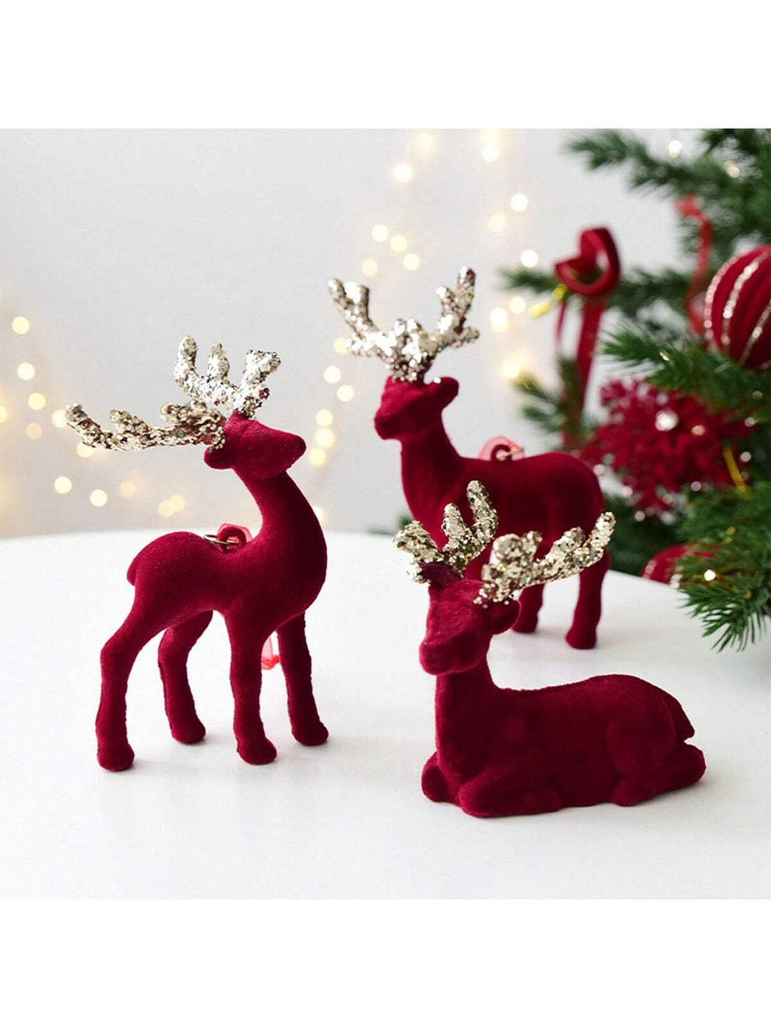 Elevate your holiday décor with these exquisite wine red reindeer ornaments, meticulously crafted with premium flocking that delivers a luxurious velvet-like texture. Each elk-inspired pendant combines traditional Christmas charm with contemporary design sensibilities, making them versatile additions to any festive display. The rich burgundy hue complements both classic and modern tree arrangements while the delicate flocking technique ensures durability and visual depth.