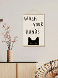 Ivory poster with black cat peeking over line and bold hand-lettered message
