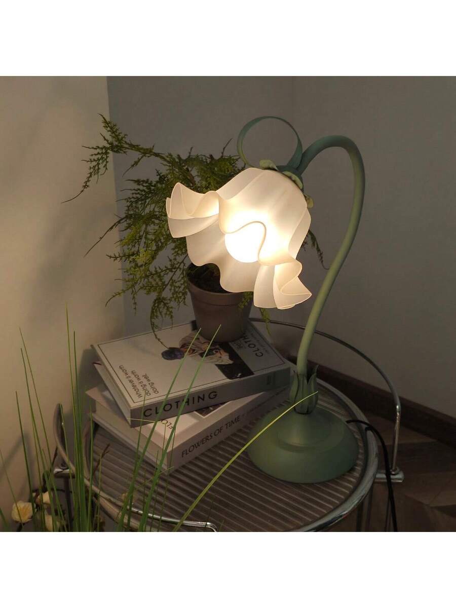 Vintage flower LED table lamp with ruffled acrylic shade and green stem.