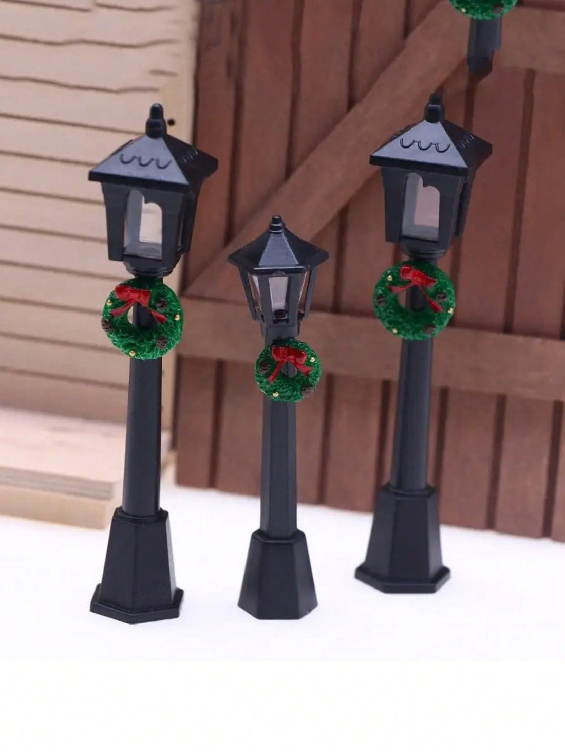 Transform your miniature displays with these charming retro street lamp models, expertly crafted to capture vintage authenticity. Each lamp features an intricately detailed Christmas wreath, making them ideal focal points for dollhouse scenes and fairy garden arrangements. The nostalgic design evokes classic streetscapes from a bygone era, while the festive wreath adds seasonal warmth to any display. Perfect for collectors and enthusiasts seeking authentic period-appropriate accessories that elevate miniatu