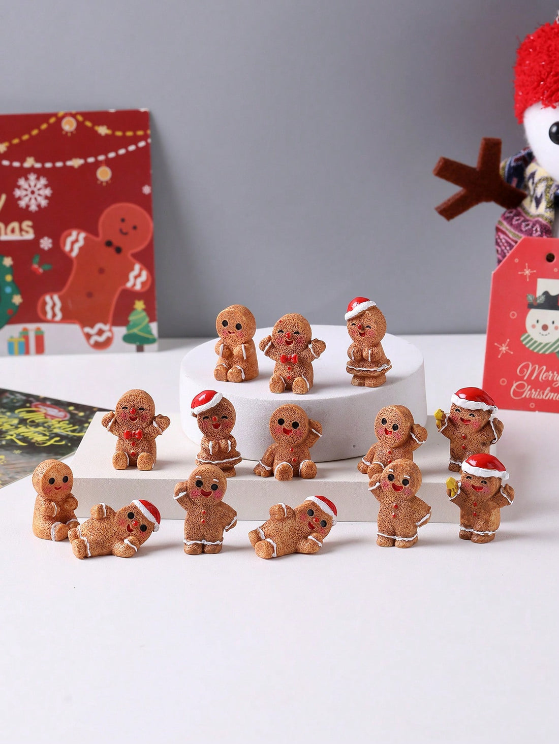 Bring festive charm to your holiday displays with these delightful mini gingerbread figurines. Crafted from durable resin, each statue captures the whimsical character of classic gingerbread designs, making them ideal for seasonal decorating, creative craft projects, and thoughtful gift-giving. Their compact size allows for versatile placement on shelves, mantels, desks, or windowsills, while their detailed craftsmanship adds authentic holiday warmth to any space. Whether you're building a festive village s