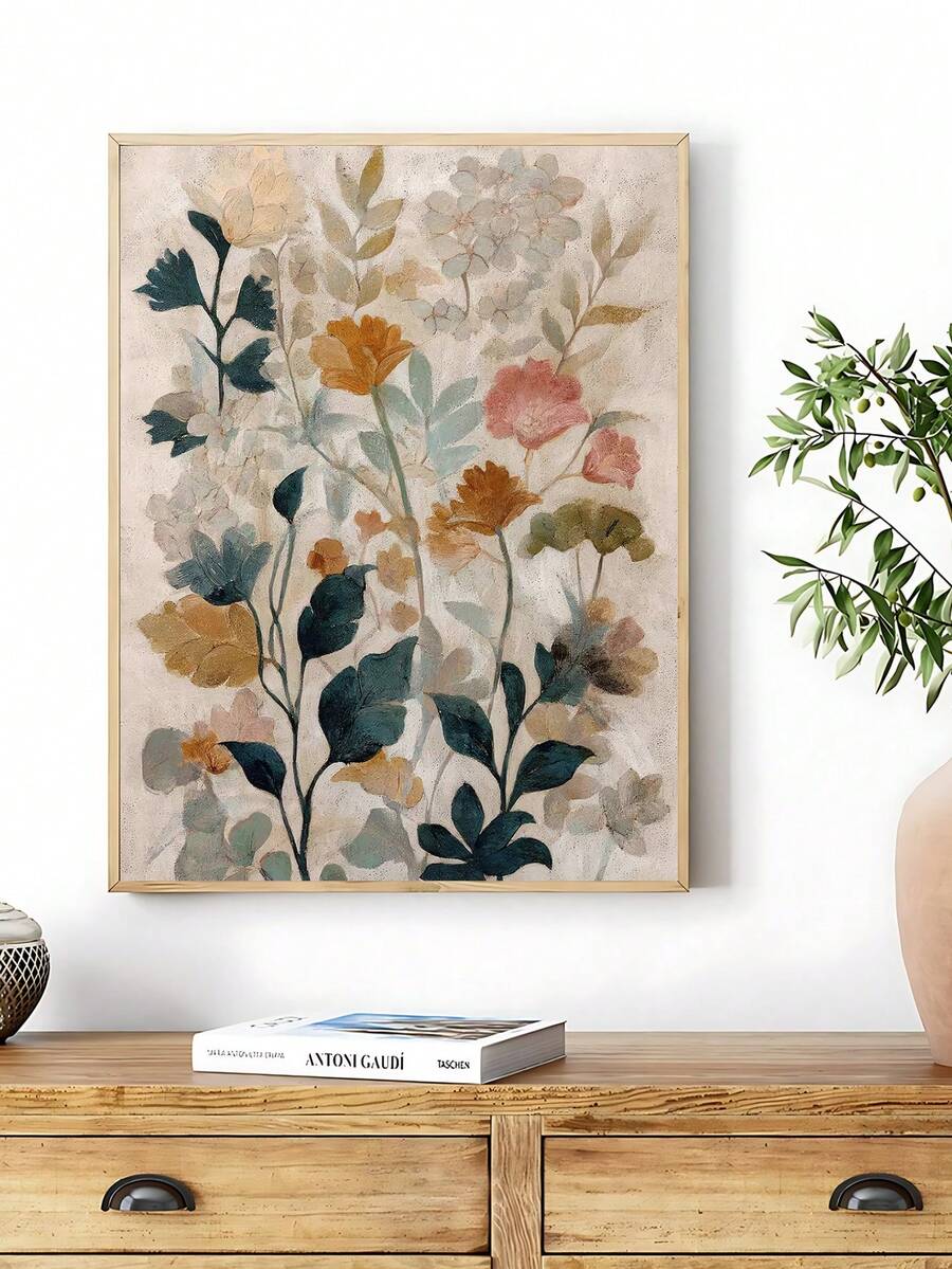 Framed abstract botanical flower wall art above console with neutral decor