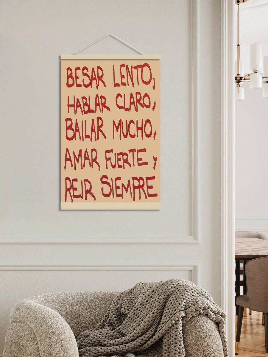 Cream and red Spanish quote hanging canvas displayed on a light wall