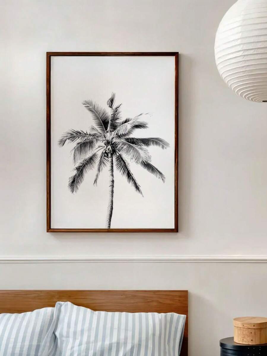 Blue beach artwork styled above a bathroom vanity
