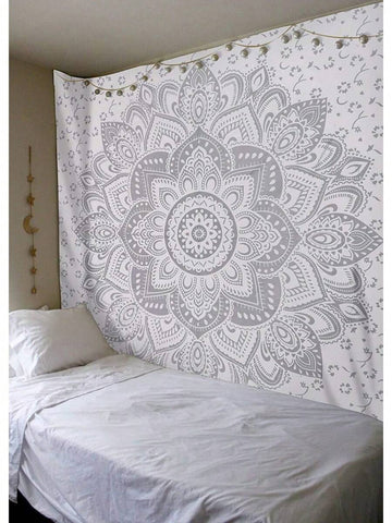 Gray white mandala tapestry wall hanging styled above bed with boho bedroom decor