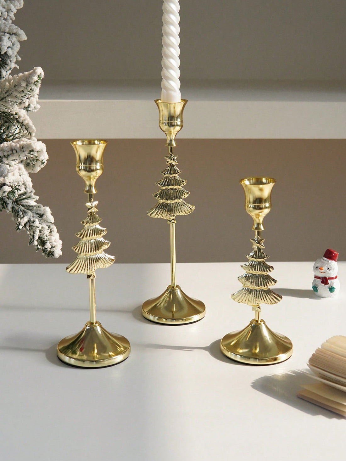 Transform your holiday décor with this sophisticated 3-piece candle holder set, featuring intricate snowflake designs in lustrous gold finish. Each holder combines timeless elegance with versatile functionality, perfect for creating ambient lighting in any setting—from intimate home gatherings to upscale restaurant displays. The refined craftsmanship and seasonal aesthetic make these holders an essential accent for festive tablescapes and year-round entertaining.