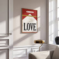 Retro love and cherub canvas poster above a light wood reading chair