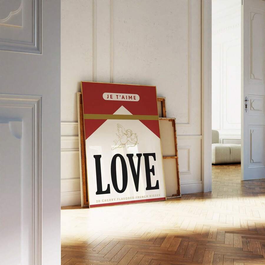 Vintage French love poster in a gold frame leaning against a paneled wall
