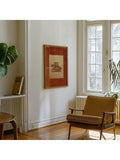 Rustic horse rider poster in a framed reading corner beside a chair and windows