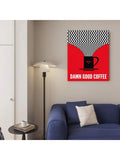 Bold red coffee poster styled above a blue sofa beside a floor lamp