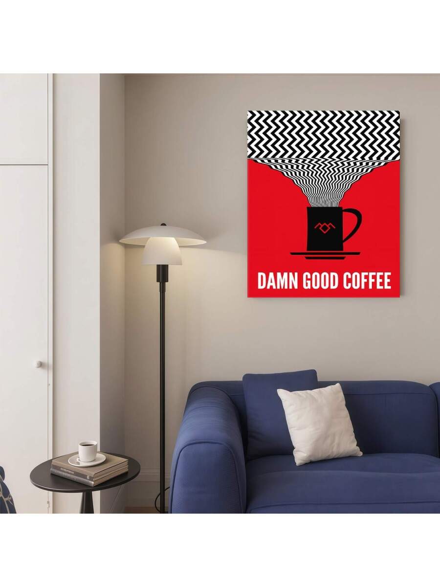 Bold red coffee poster styled above a blue sofa beside a floor lamp