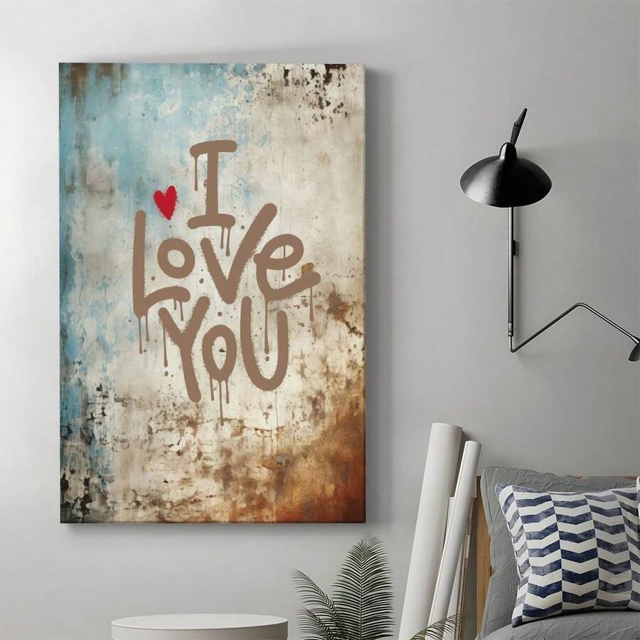 Gallery wrapped love quote canvas hanging in bedroom with graffiti style text and red heart