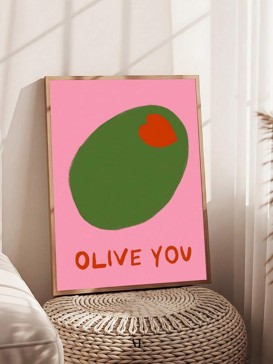 Framed pink olive kitchen wall art above a small stool beside a sunny window