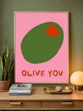 Preppy pink olive canvas artwork displayed above a sideboard with lamp and houseplant