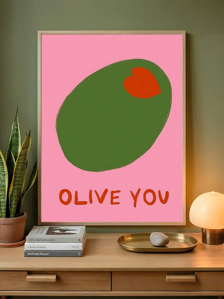 Preppy pink olive canvas artwork displayed above a sideboard with lamp and houseplant