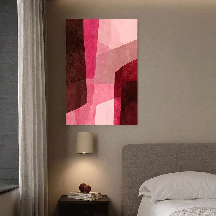 Vertical geometric abstract canvas artwork adding soft pink color to a bedroom wall
