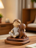 Rustic girl hugging dog resin figurine with warm carved texture.