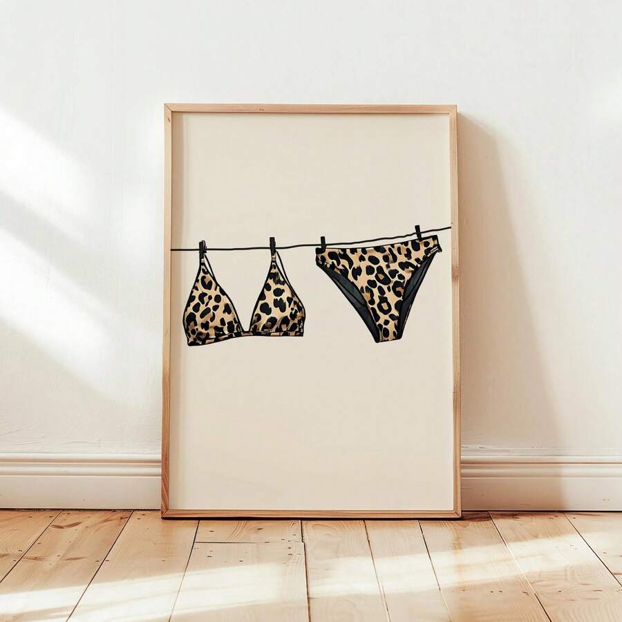 Transform your space with this striking beige leopard print bikini canvas wall art. Featuring a modern graphic design, this versatile piece brings coastal charm to beach houses, dorms, and bedrooms alike. The waterproof canvas construction ensures durability, while the removable design allows you to update your décor whenever inspiration strikes. Available in both framed and unframed options, it's the perfect statement piece for adding personality and style to any room.