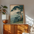Ukiyo-e-inspired mountain pine poster above a sideboard with home decor