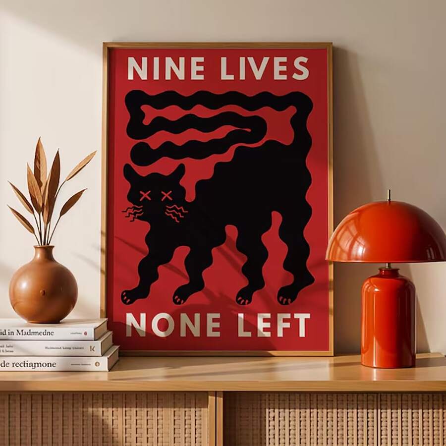 Funny modern black cat poster on red background with bold white text reading NINE LIVES NONE LEFT