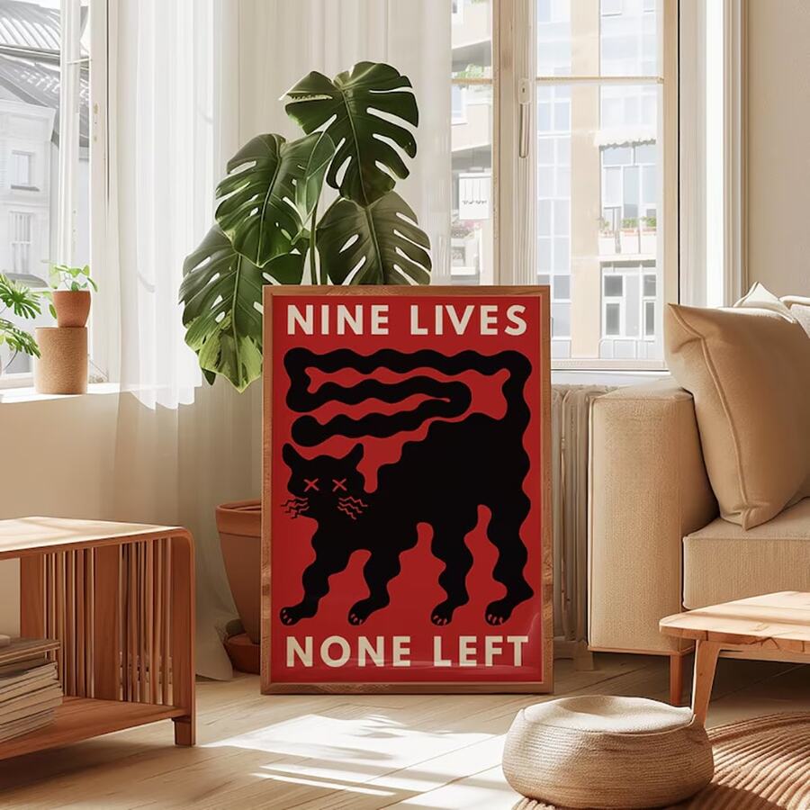 Abstract black cat wall art with X eyes wavy whiskers and red pop art background