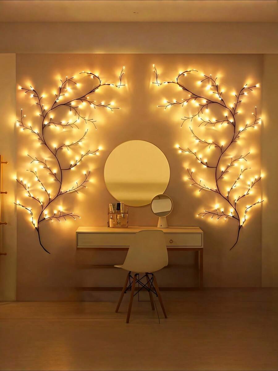 Flexible LED willow branch lamp glowing warm white around wall decor.