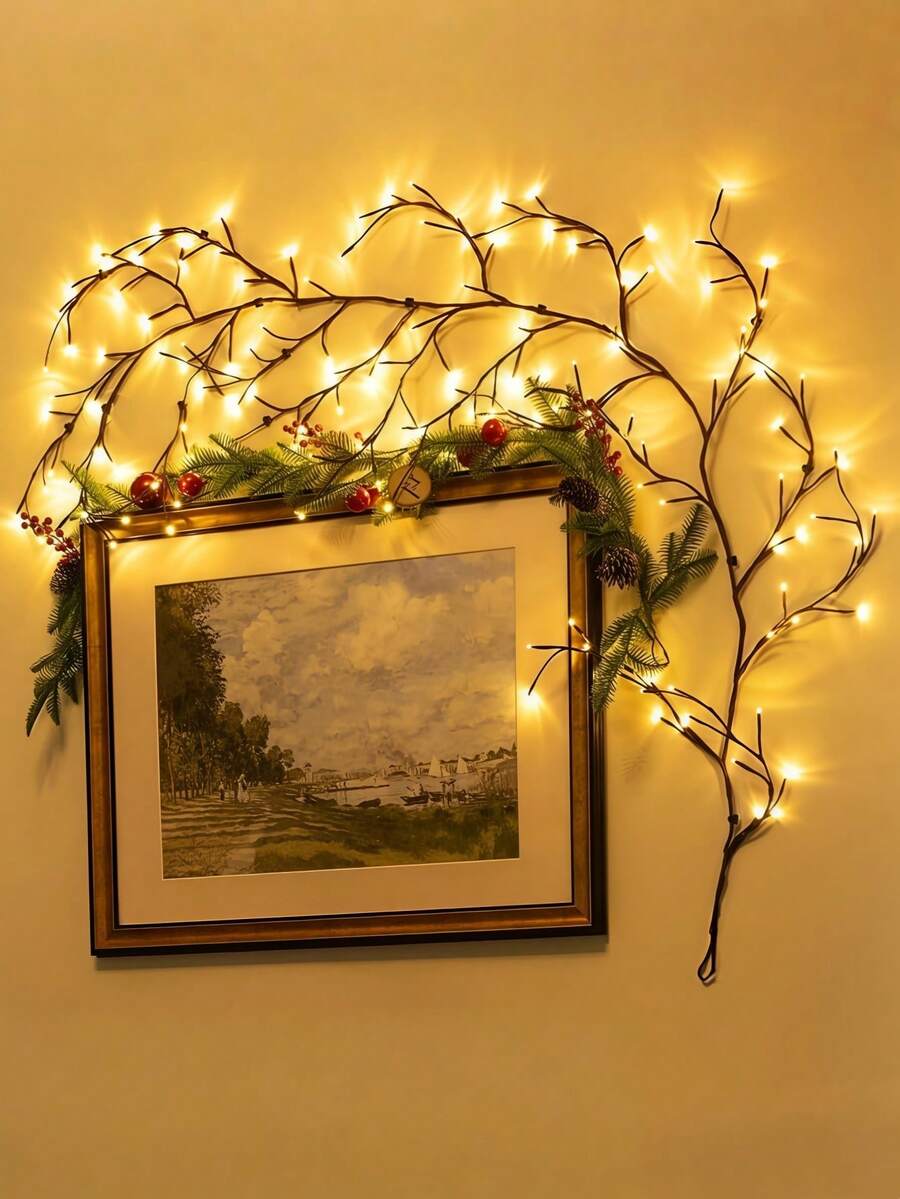 Flexible LED willow branch lamp glowing warm white around wall decor.