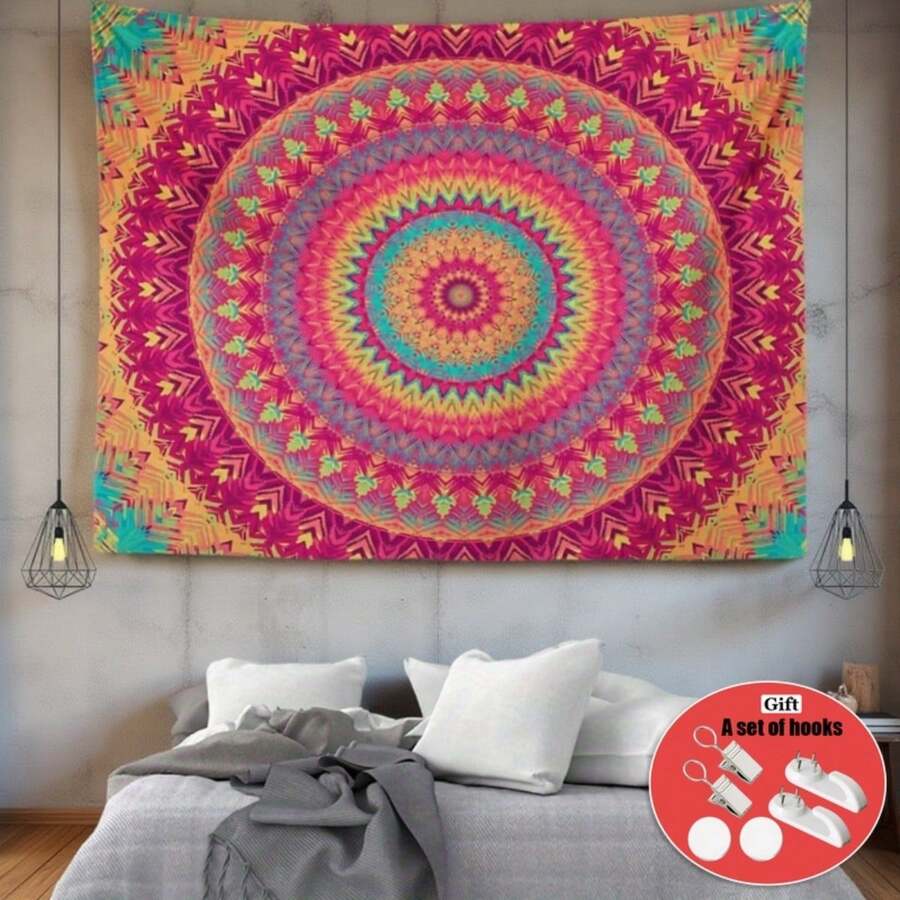 Rectangular bohemian mandala tapestry hanging above bed with bright pink orange and teal pattern