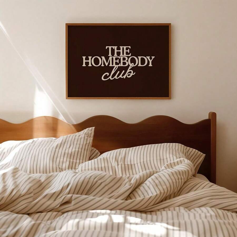 Embrace the art of doing nothing with this retro "Homebody Club" canvas poster. Featuring minimalist vintage-inspired design in warm redwood tones, this graphic piece celebrates the joy of staying cozy at home. Perfect for living rooms, bedrooms, or any space that needs a touch of nostalgic charm, it's an ideal gift for anyone who values comfort and style. The canvas material ensures durability while maintaining that classic aesthetic appeal.